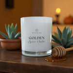 Golden Agave Nectar candle on table